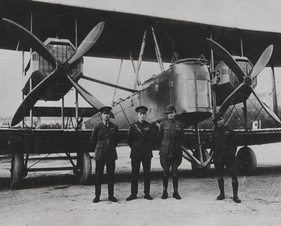 Pilots and mechanics in front of their airplane 